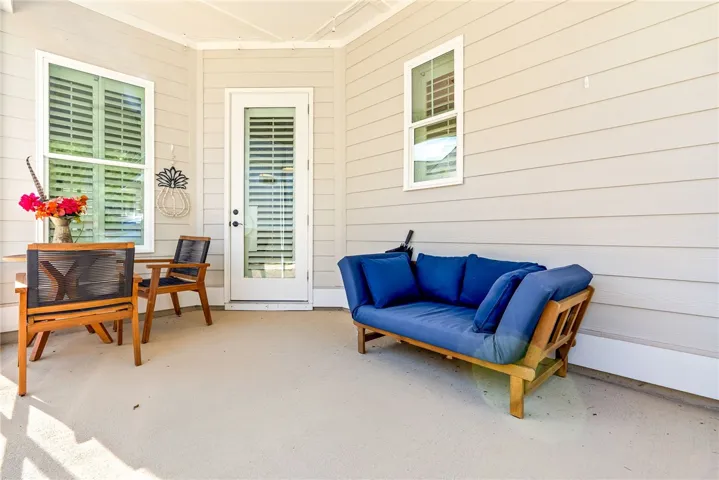 An inviting covered patio provides a delightful outdoor living space.