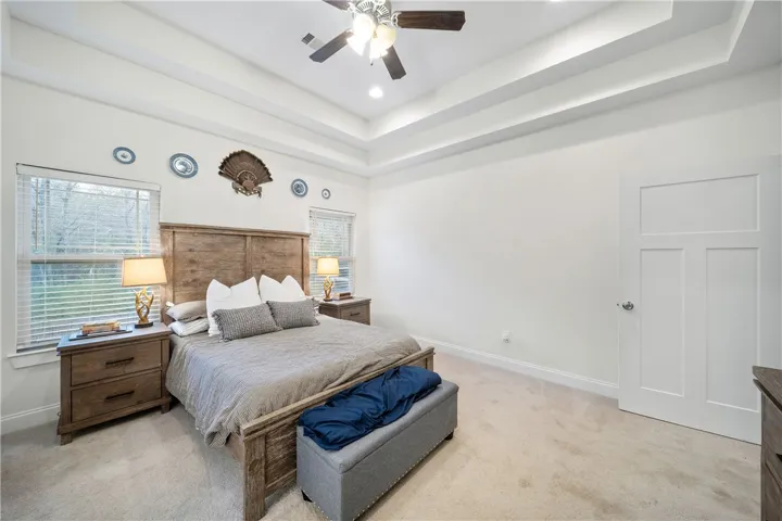 A primary bedroom offering ample space for rest and rejuvenation.