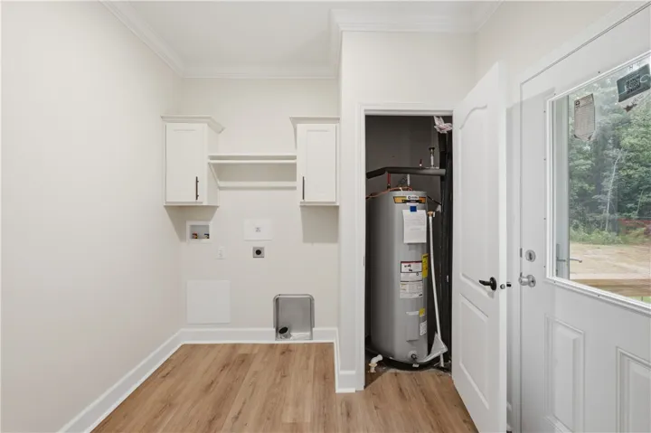 Functional utility room with ample storage and easy outdoor access.