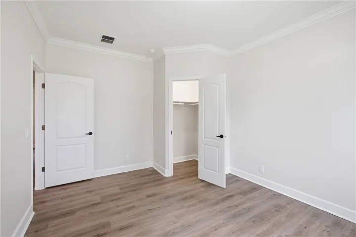 Neutral tones and durable flooring create a versatile space ready for personalization.