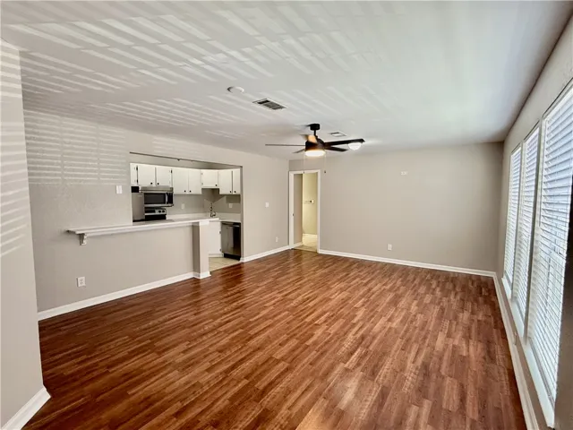 Living room is open to the kitchen.  Freshly painted, smooth ceilings and plenty of natural light.