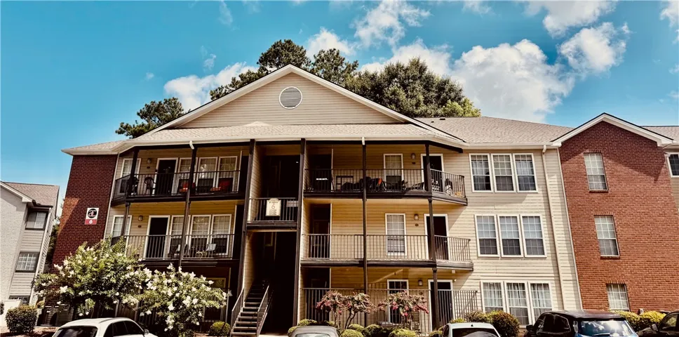 Multi-level living with individual balconies and ample outdoor space in a residential setting.