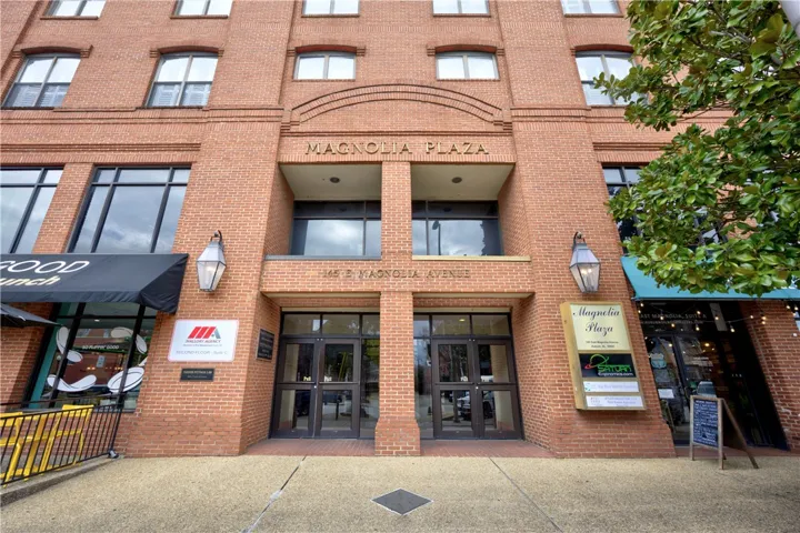 The striking brick facade of Magnolia Plaza offers an inviting entry to commercial spaces.