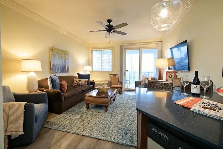 Crisp crown molding accents the smooth ceilings of this welcoming open-concept living area.