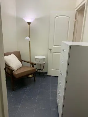 A well-appointed corner offers a quiet retreat for reading and contemplation.