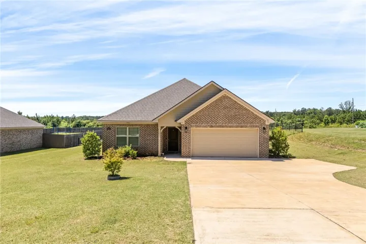 A classic brick exterior offers enduring appeal with a convenient attached garage.