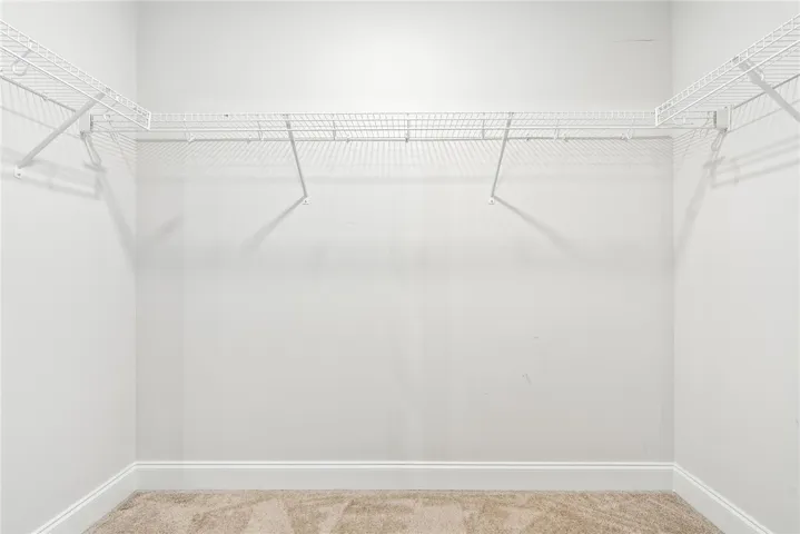 Streamlined wire shelving provides ample organization within this closet space.