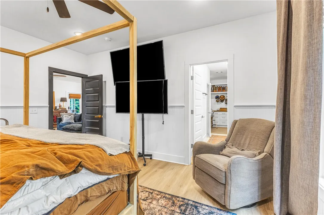 A restful bedroom offers direct access to an adjoining room, perfect for a personal office or private retreat.