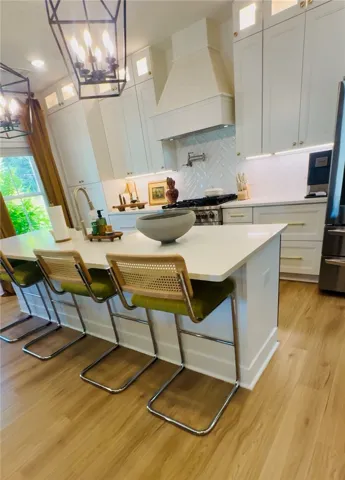 Culinary delights await in this bright kitchen with a spacious island, perfect for entertaining.