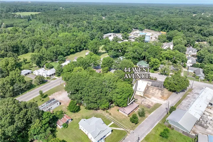 Discover a tranquil setting with ample green spaces and nearby commercial amenities.
