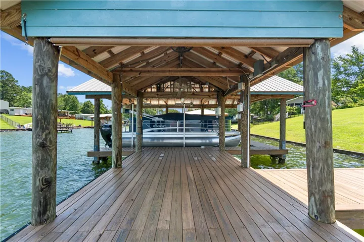 Boathouse with a large dock provides direct access to serene waters.