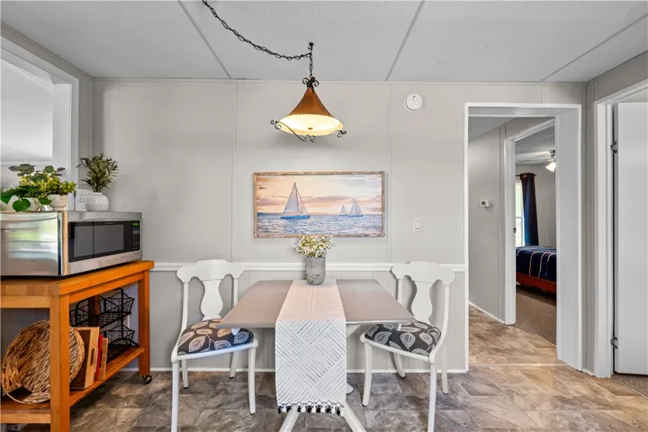 A quaint breakfast nook with a charming nautical theme and warm lighting.