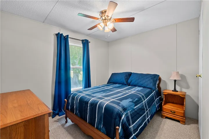 A comfortable bedroom with a warm ambiance, perfect for peaceful rest.