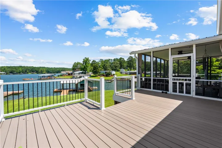 Enjoy idyllic waterfront views from this expansive deck and screened-in porch.