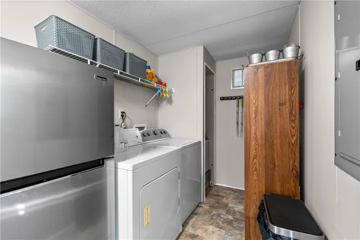 Functional laundry space with easy-care flooring and convenient appliance placement.