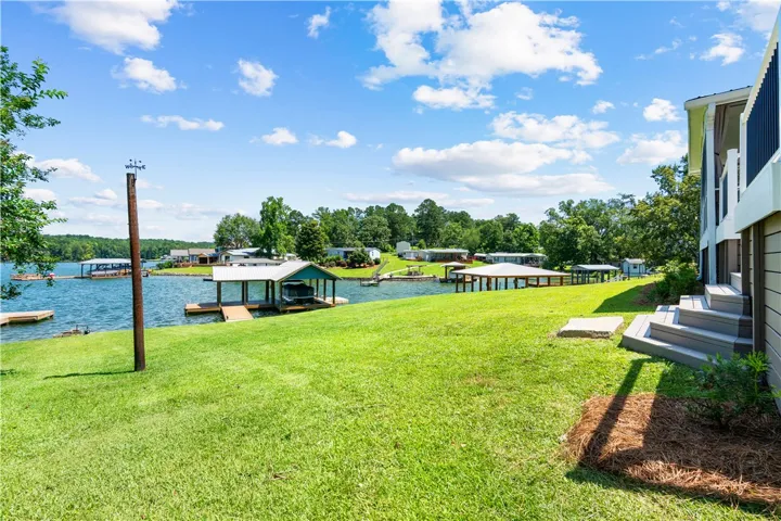 Enjoy idyllic waterfront living from this property, complete with private docks and vast lake views.