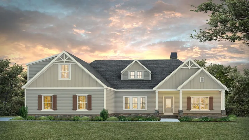 Craftsman-style facade with gables and stone accents creates inviting curb appeal.