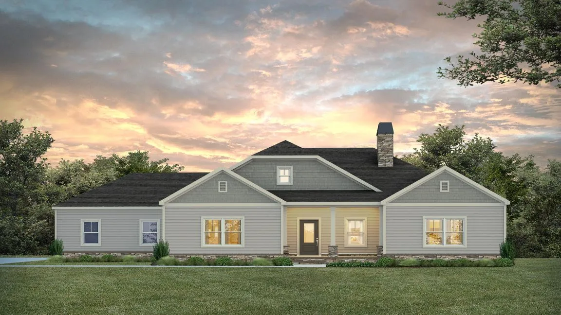 A classic ranch home presents an inviting facade beneath a picturesque sky.