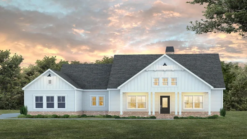 A classic white facade with brick accents and a welcoming covered entry.