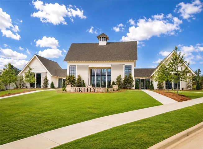 Architectural splendor awaits in this striking, modern farmhouse-inspired building with a grand entrance.