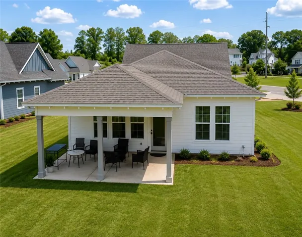 A private rear patio offers outdoor enjoyment, extending this charming home's living space.