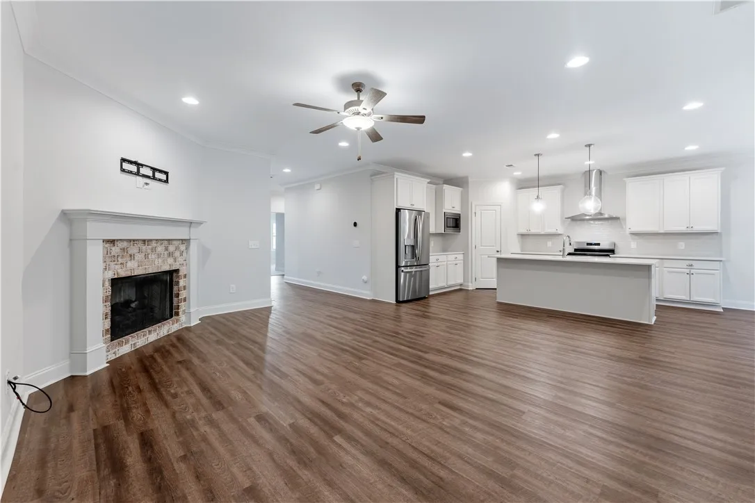 An open floorplan seamlessly connects the living area with a contemporary kitchen, ideal for entertaining.