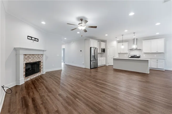 An open floorplan seamlessly connects the living area with a contemporary kitchen, ideal for entertaining.