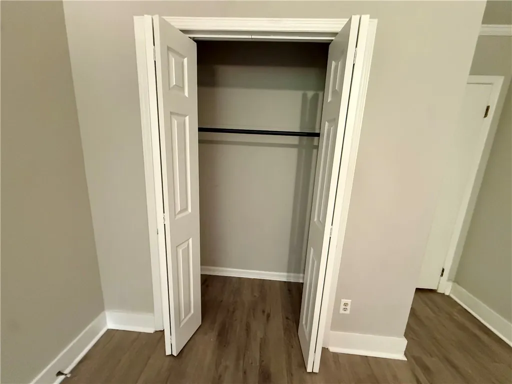 Functional bi-fold doors open to a generous closet, perfect for organized storage.