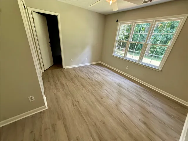 A quiet space with light flooring and abundant natural light.