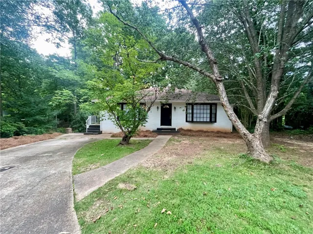 A charming single-story residence nestled among mature trees offers serene outdoor​​‌​​​​‌​​‌‌​‌‌​​​‌‌​‌​‌​‌​​​‌​​ living.