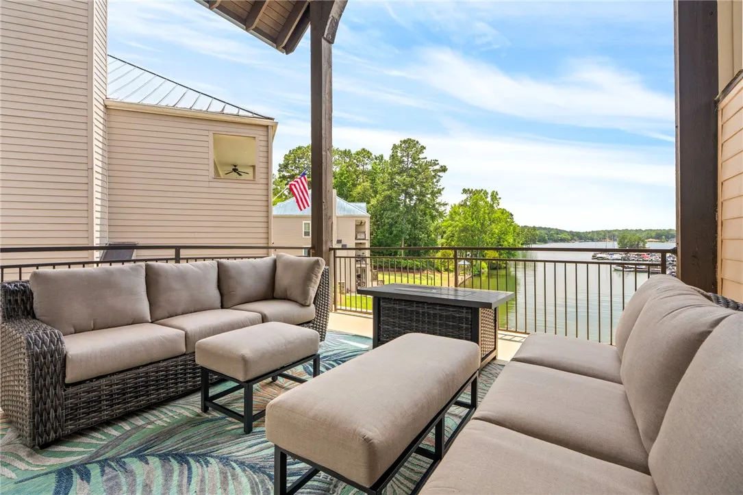 A spacious covered patio offers waterfront views, perfect for serene relaxation.