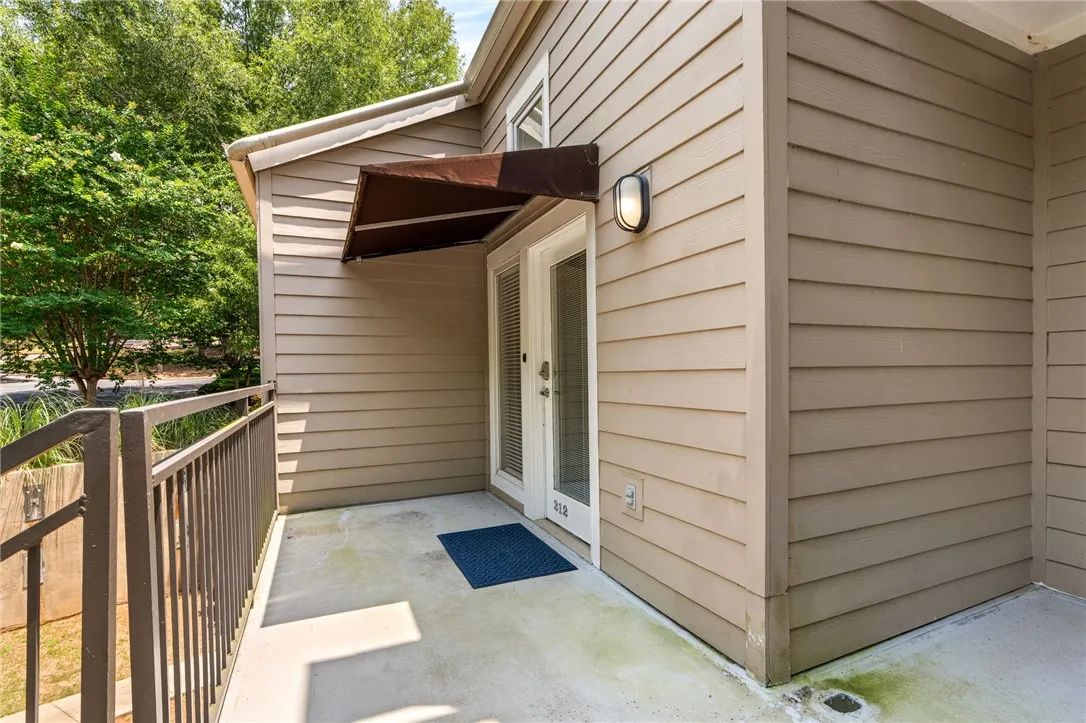 A welcoming entry patio provides an inviting transition to this home's private space.