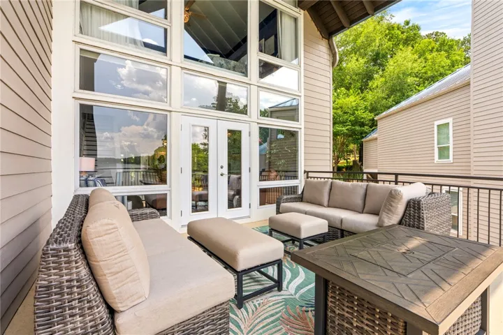 An inviting outdoor living space features a spacious patio with ample seating and scenic views.