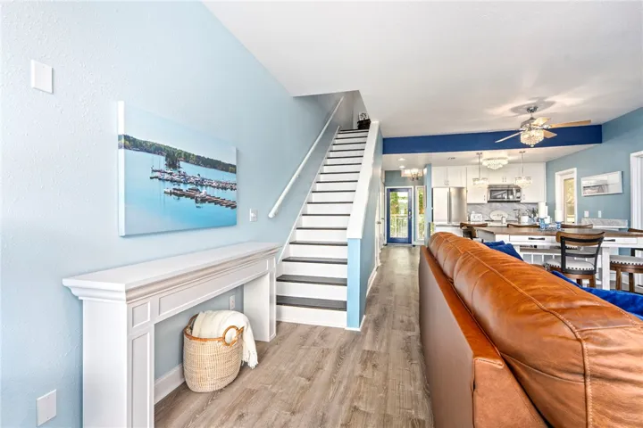 An open concept living area transitions to a modern kitchen with a convenient breakfast bar.