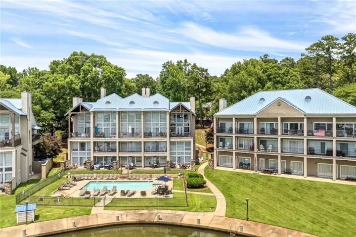 These lakeside condominiums offer spacious private balconies and a refreshing pool, creating an idyllic retreat.