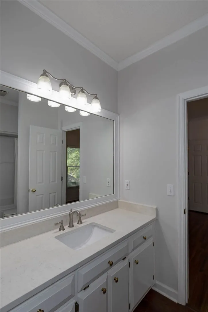 A pristine vanity with generous counter space, ideal for daily routines.