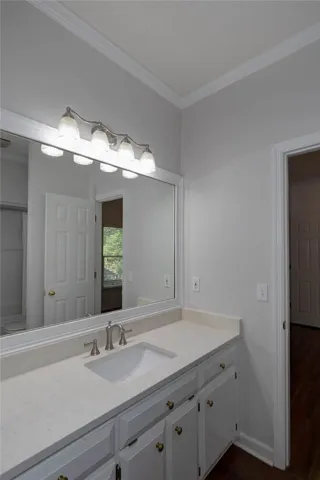 A pristine vanity with generous counter space, ideal for daily routines.