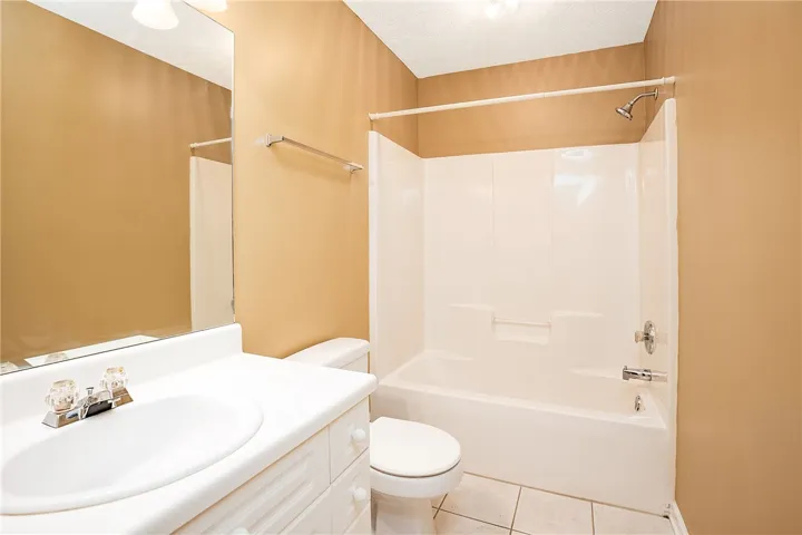A well-maintained bathroom offers a clean vanity, shower, and commode for daily routines.