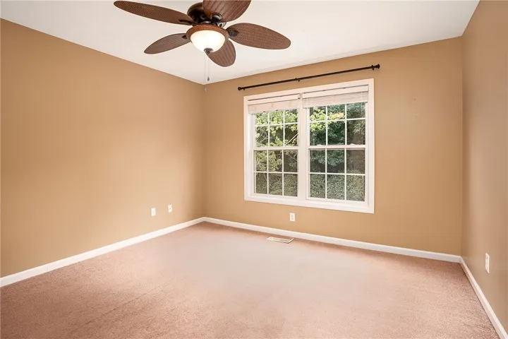 A well-proportioned bedroom offers natural light and a comforting atmosphere.