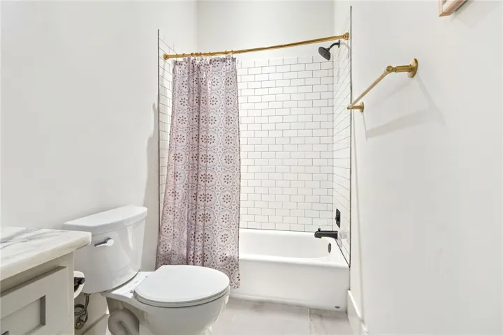 A pristine bathroom featuring subway tile and a classic bathtub for ultimate relaxation.