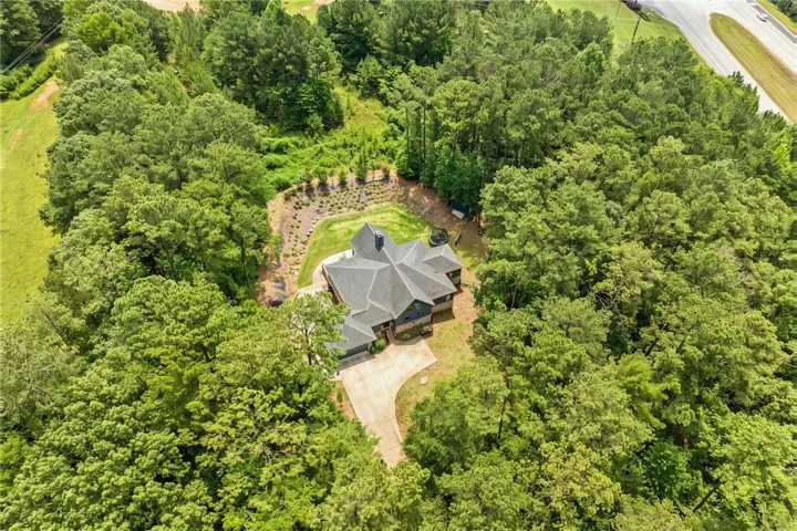 Secluded estate surrounded by mature trees, offering ultimate privacy and a serene natural setting.