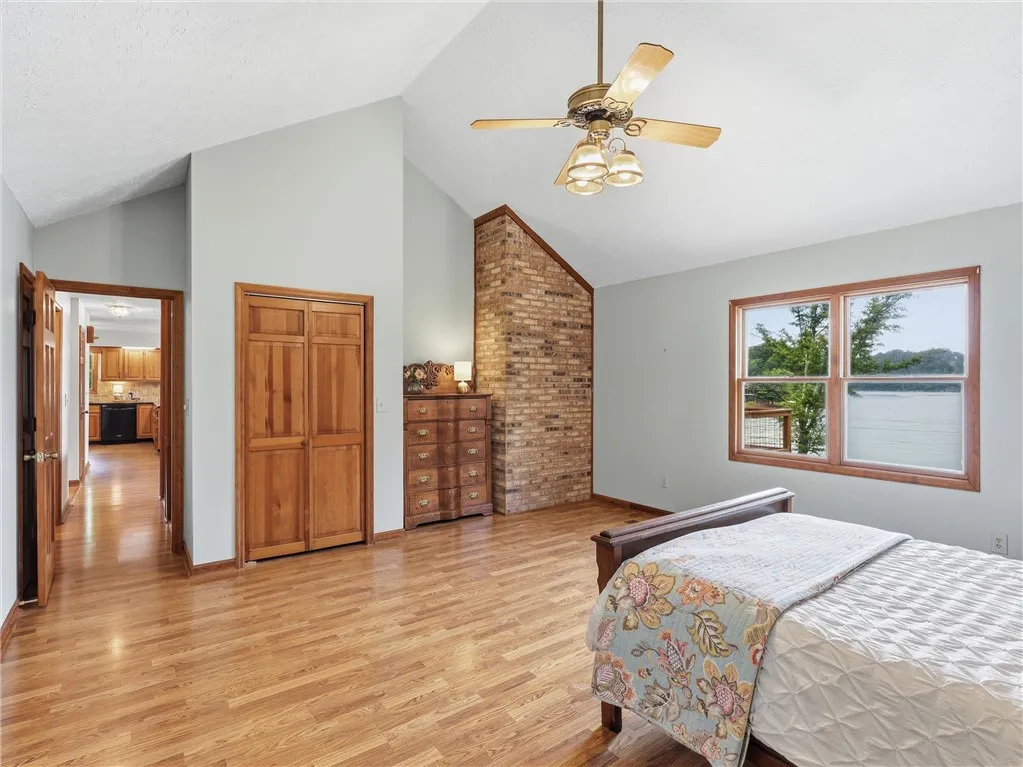 This spacious retreat features exposed brick, tall ceilings and another great view of the lake.  Wouldn't it be nice to wake up to that every day?