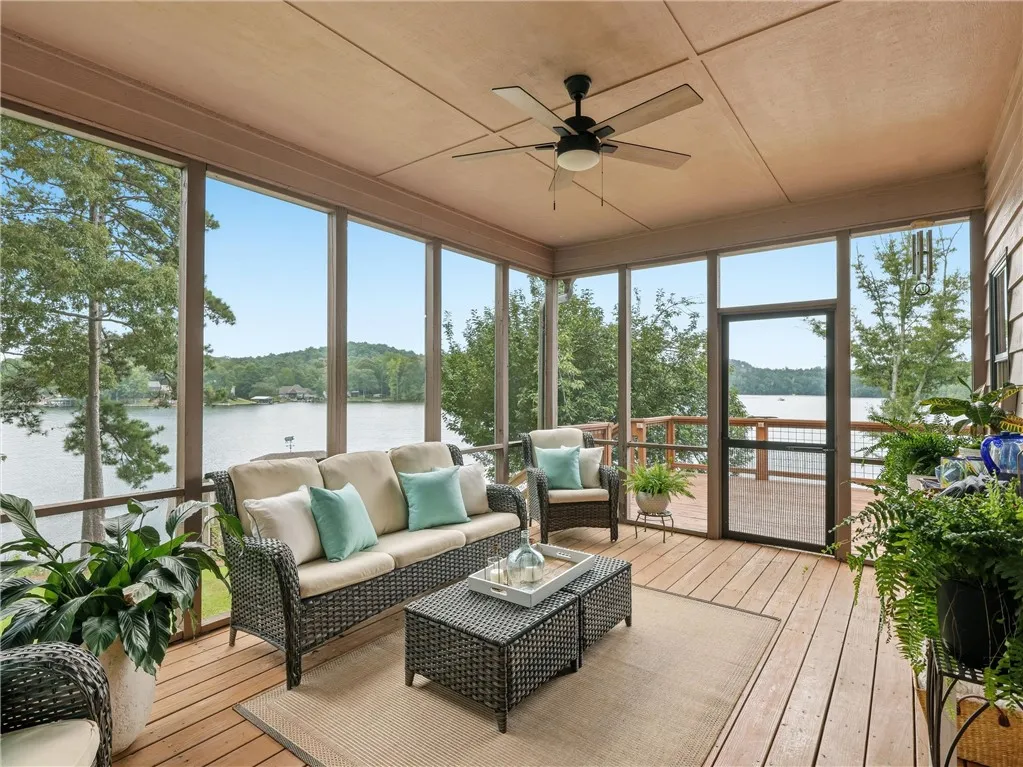 Just off the dining room and kitchen is the screened in  porch.  While sitting outside enjoying a beverage,  you will be surrounded by views of the lake and the undeveloped land across the lake from the property.  A new ceiling fan has been installed for maximum comfort..