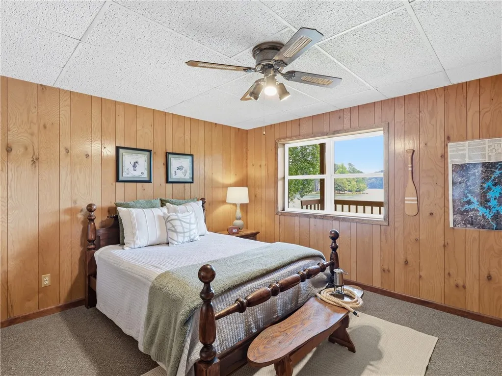 This downstairs bedroom also offers serene lake views.