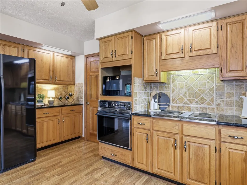 The back of the kitchen features a beverage area with additional cabinets for storage.  Beyond that is the laundry room, additional pantry and oversized two car garage.