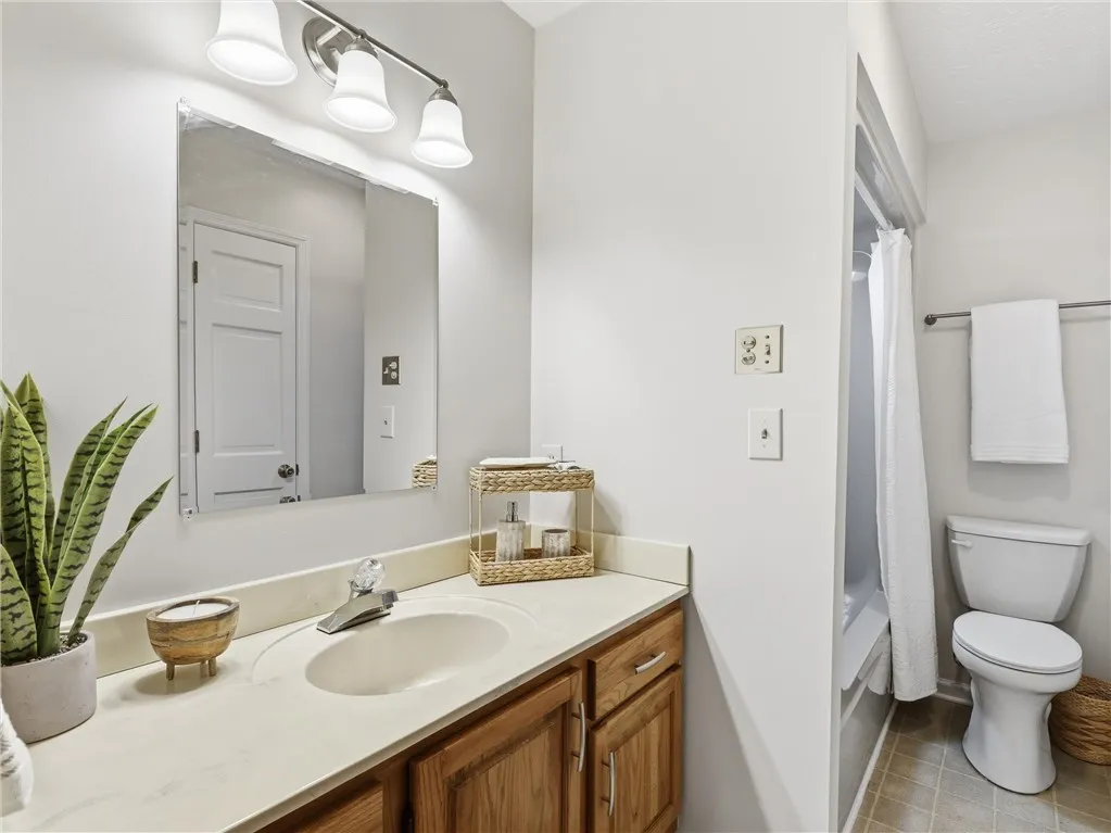 A freshly painted full bath services the upstairs guests.