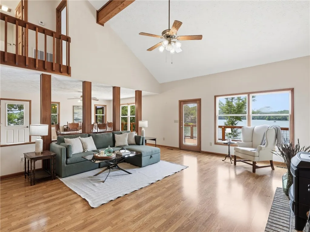 Right inside the front door is the cozy great room with beautiful wood work, tall ceilings and a wood burning stove.   With a great view of the lake, it's also open to the dining room and kitchen.