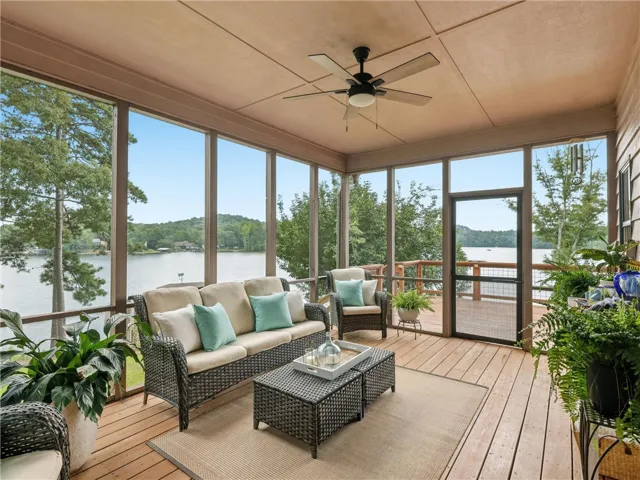 Just off the dining room and kitchen is the screened in  porch.  While sitting outside enjoying a beverage,  you will be surrounded by views of the lake and the undeveloped land across the lake from the property.  A new ceiling fan has been installed for maximum comfort..