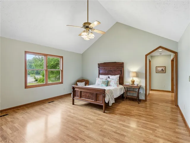 Just off the great room, the main bedroom showcases natural light and an elegant vaulted ceiling.  There are two closets and one is a walk in.