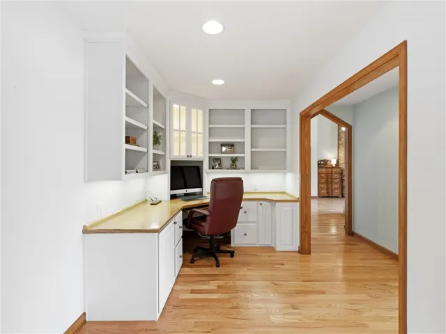 Just off the main bedroom is this great office/sitting room space.  Custom built-in cabinetry and warm wood flooring define this adaptable space.